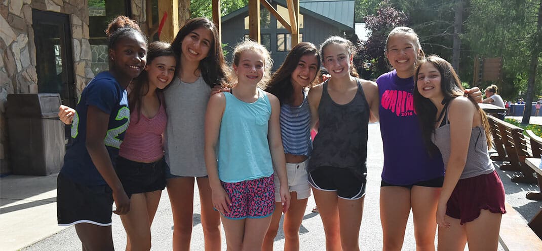 group of girls smiling at summer camp