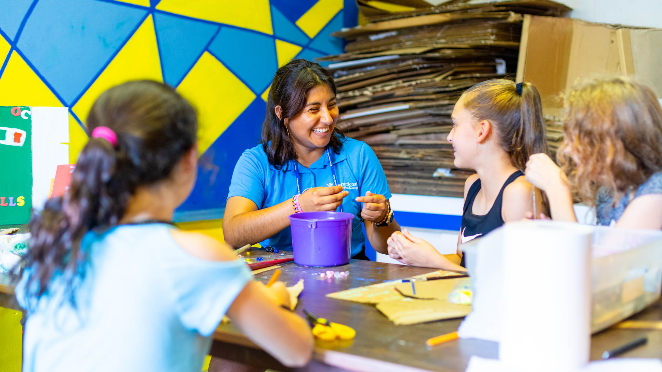 recreation leader crafting with campers