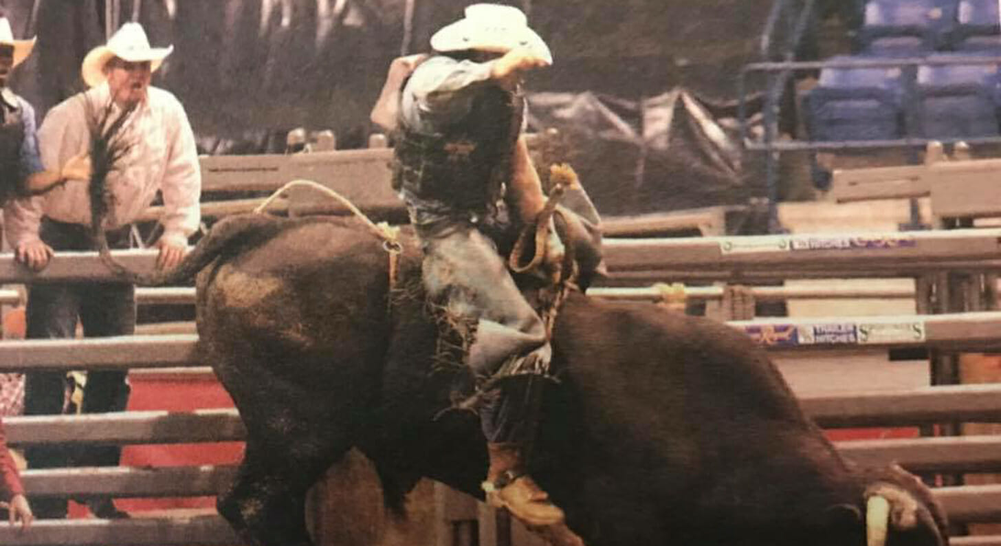 brent riding a rodeo bull