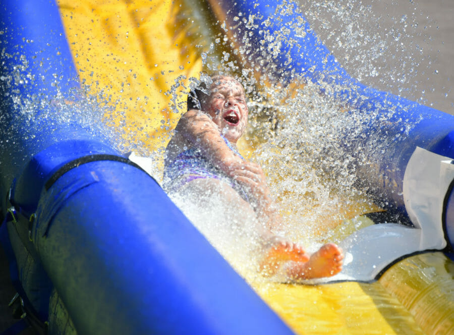 a girl going down a water slide