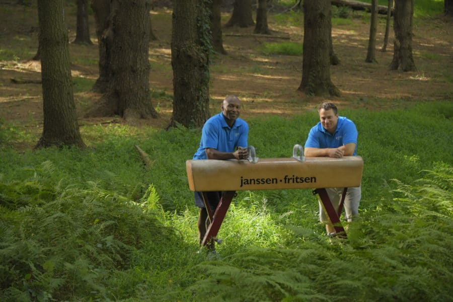 staff members on the pommel horse in the woods