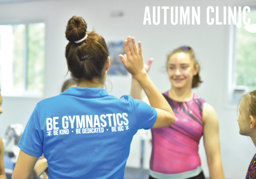 staff member giving a gymnast a high five