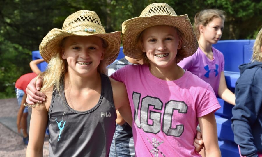 two girls in cowboy hats