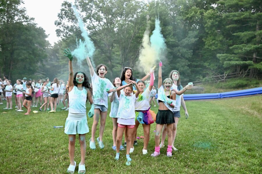 campers playing with colored spray paint